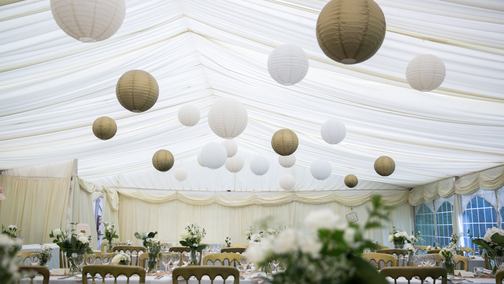 White and gold marquee wedding lanterns