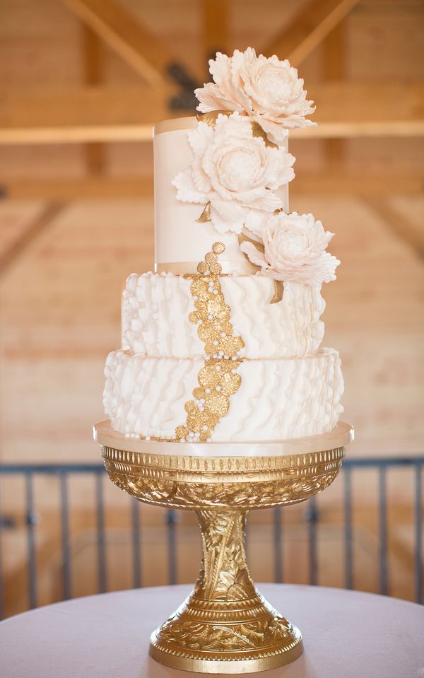 charming wedding cake with gold garnish