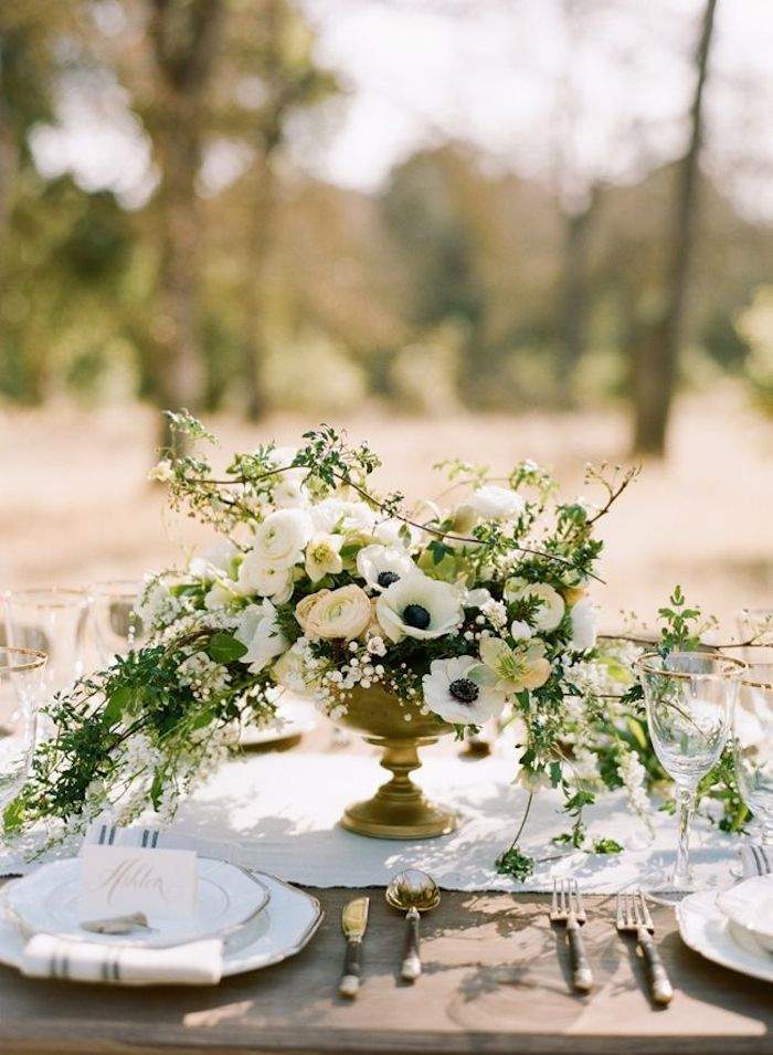 neatly table set for rustic wedding