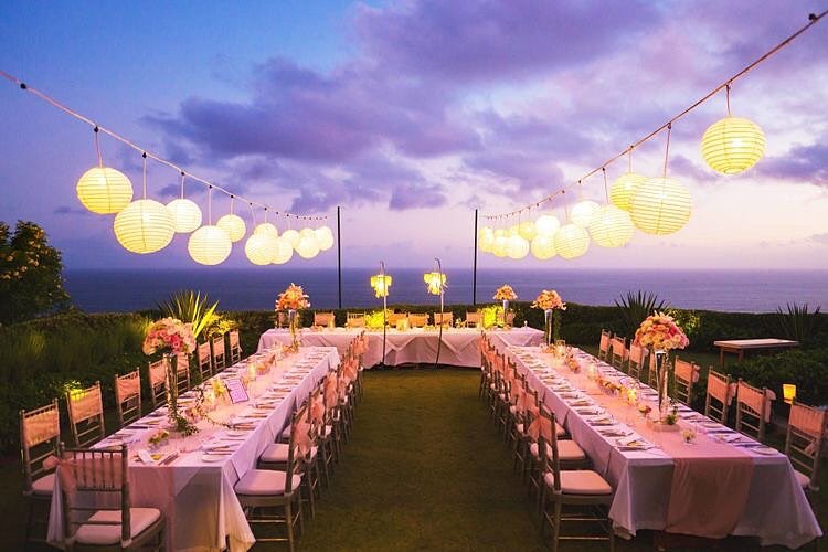 night beach wedding with lantern