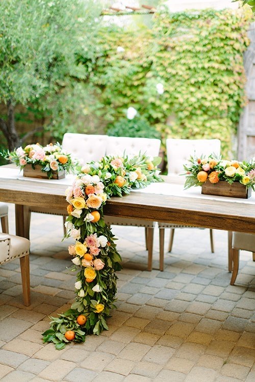 table garland greenery with citrus fruits