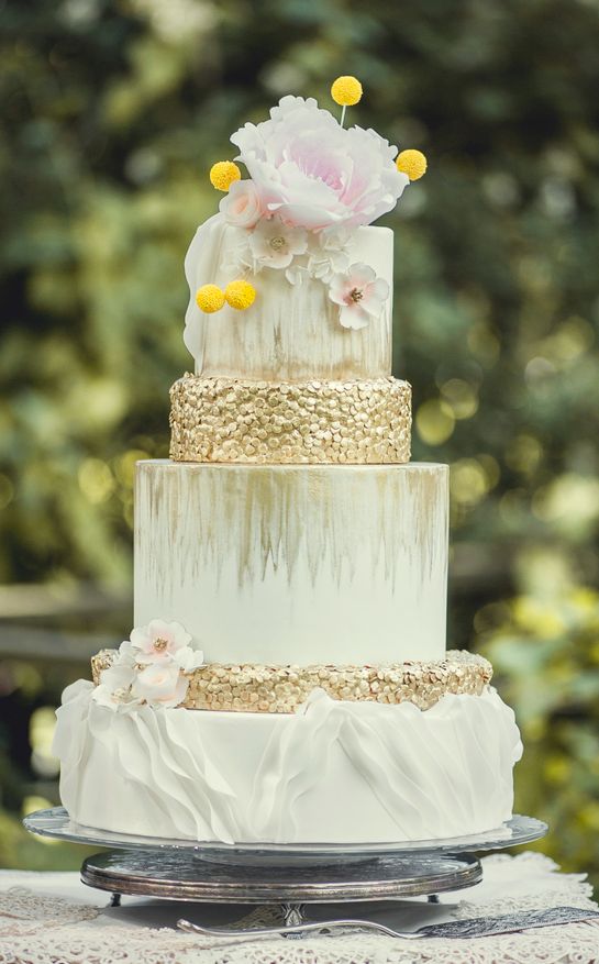 white chic wedding cake with sugar oat topping