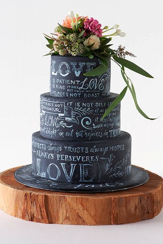 black wedding cake with floral topping