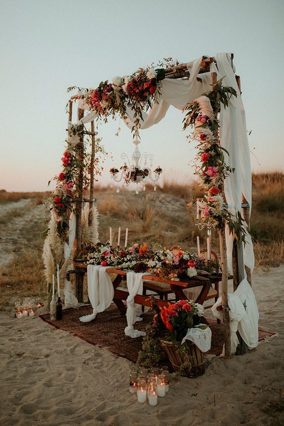 Bohemian wedding arch with sheer linen decoration