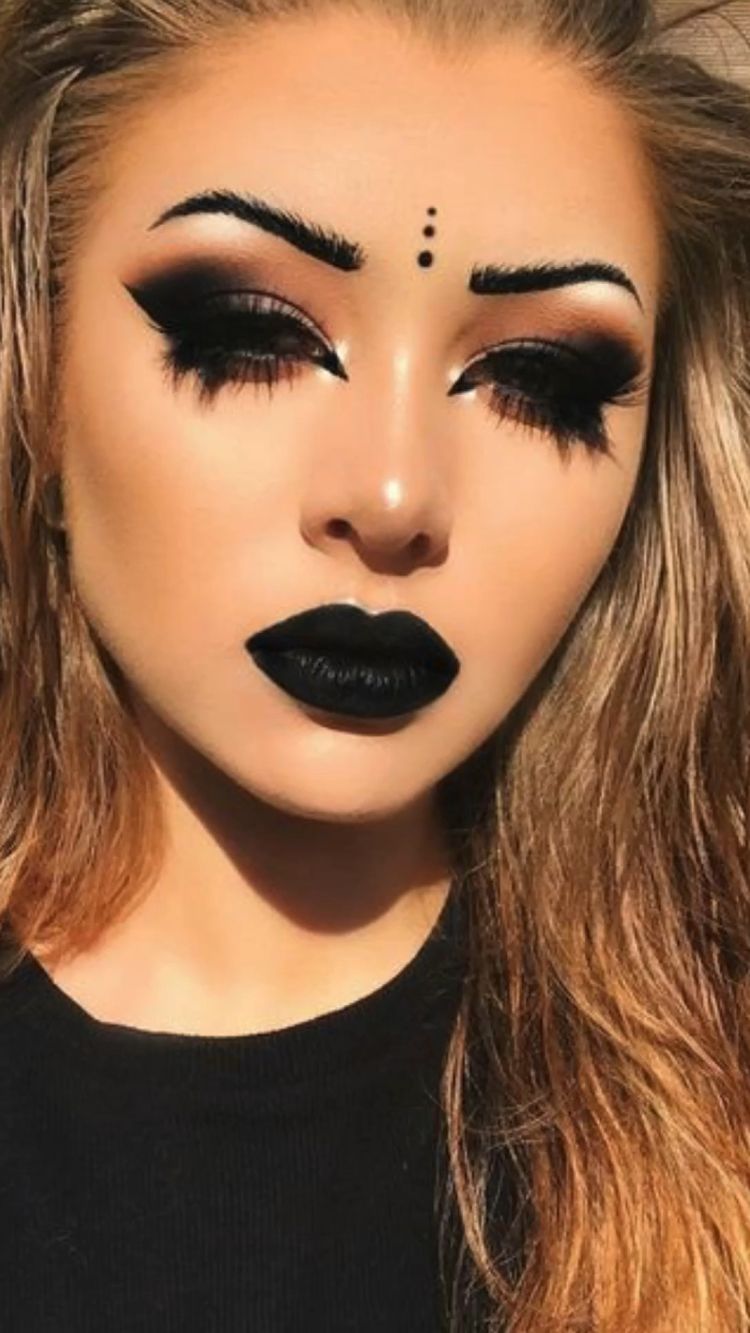 bold haloween makeup with long eyelashes