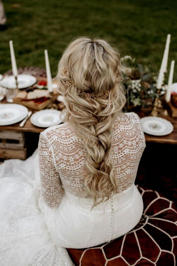 Messy braid hairstyle with a rustic flower crown