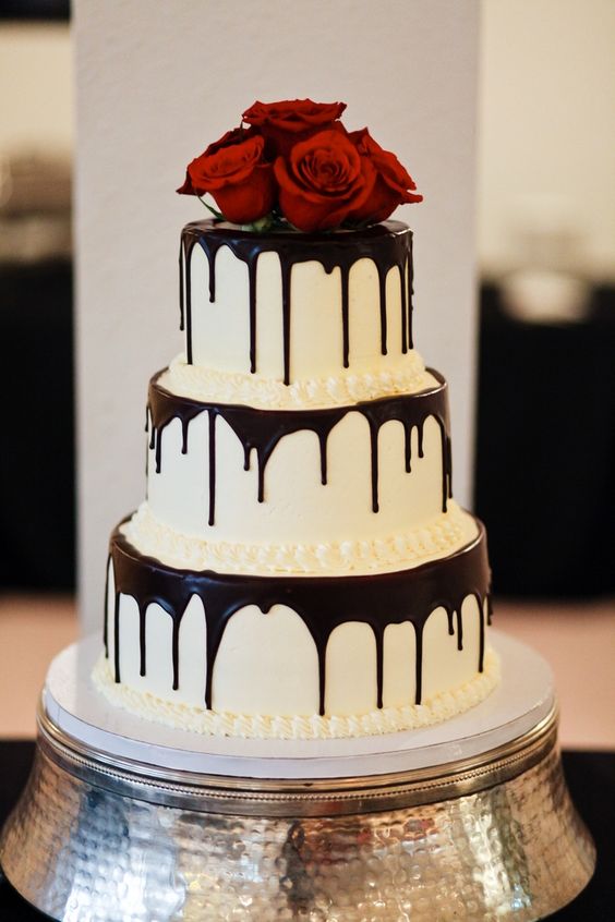 bold with red roses for topper in your halloween wedding cake design